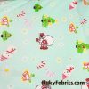 Christmas Print on Mint Background Cotton Rib Fabric