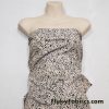 Black Pebbles on a Light Vanilla Cream Background Poly Spandex Fabric