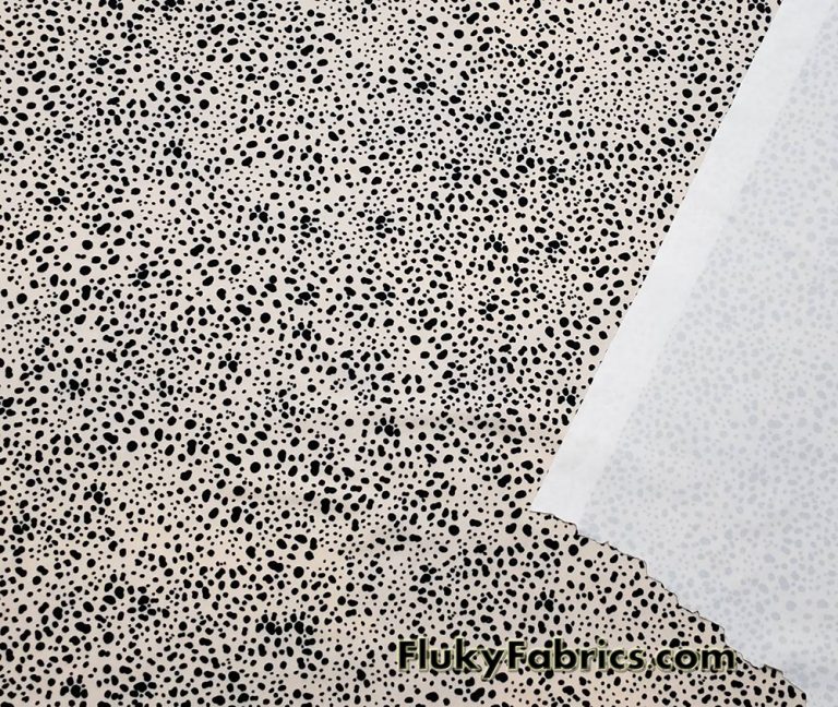 Black Pebbles on a Light Vanilla Cream Background Poly Spandex Fabric