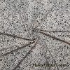 Black Pebbles on a Light Vanilla Cream Background Poly Spandex Fabric