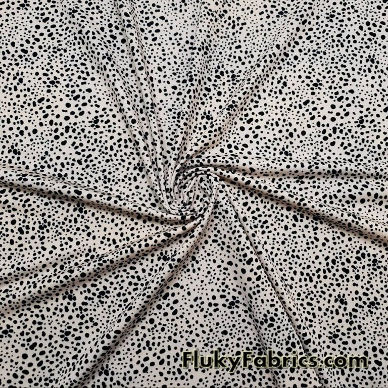 Black Pebbles on a Light Vanilla Cream Background Poly Spandex Fabric