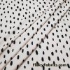 On Trend Black Irregular Oval Dots Print on an Ivory Background Nylon Spandex Fabric
