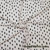 On Trend Black Irregular Oval Dots Print on an Ivory Background Nylon Spandex Fabric