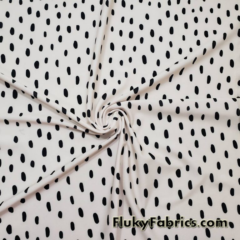 On Trend Black Irregular Oval Dots Print on an Ivory Background Nylon Spandex Fabric