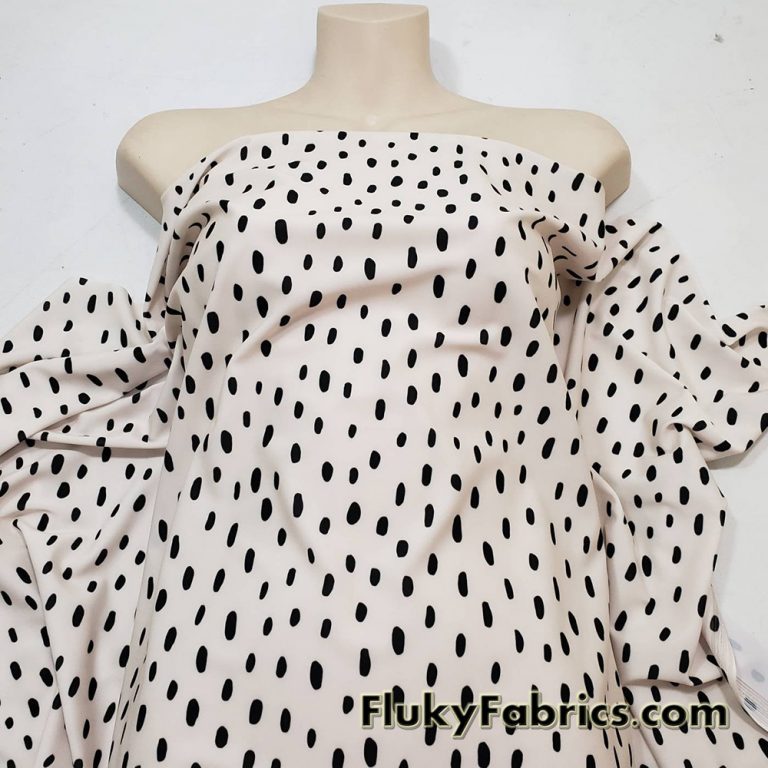 On Trend Black Irregular Oval Dots Print on an Ivory Background Nylon Spandex Fabric
