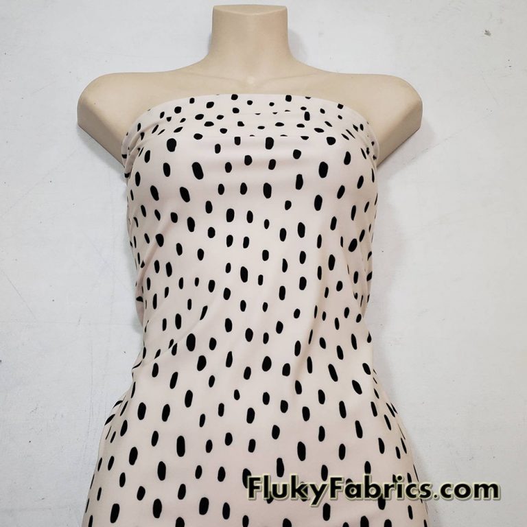On Trend Black Irregular Oval Dots Print on an Ivory Background Nylon Spandex Fabric
