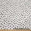 On Trend Black Irregular Oval Dots Print on an Ivory Background Nylon Spandex Fabric