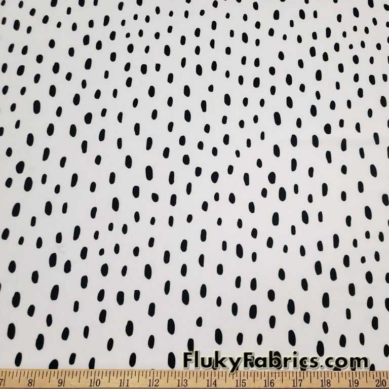 On Trend Black Irregular Oval Dots Print on an Ivory Background Nylon Spandex Fabric