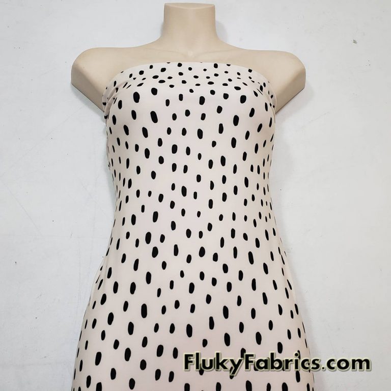 On Trend Black Irregular Oval Dots Print on an Ivory Background Nylon Spandex Fabric