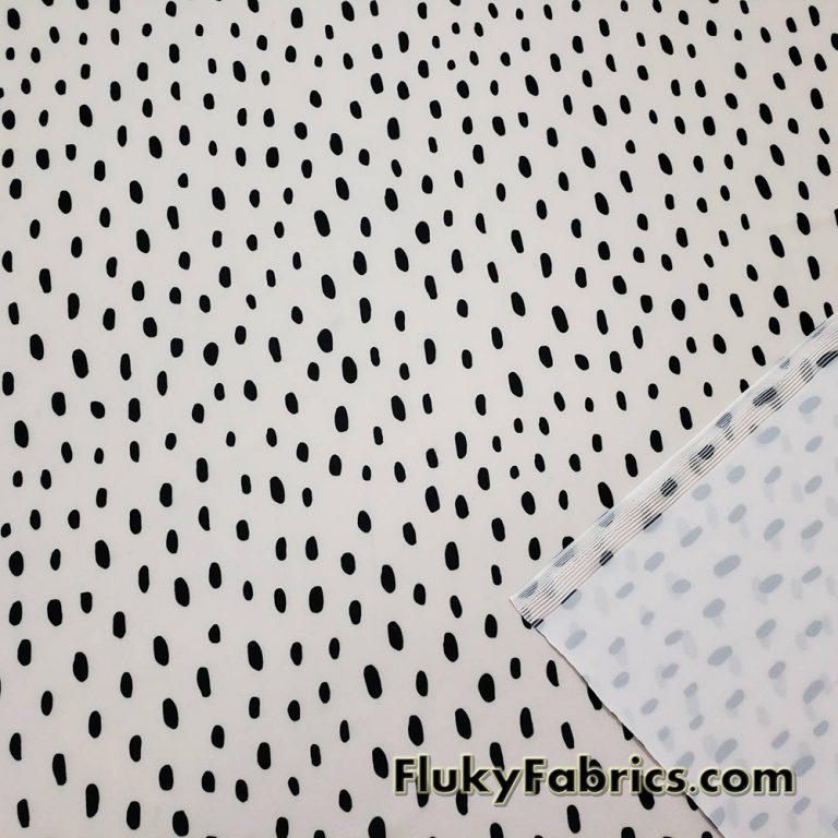 On Trend Black Irregular Oval Dots Print on an Ivory Background Nylon Spandex Fabric