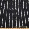 Gray Skeleton Bones Print on Black Cotton Spandex Fabric at FlukyFabrics.com