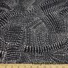 Abstract White Swarming Pebbles on Black Nylon Spandex Swimsuit Fabric at FlukyFabrics.com