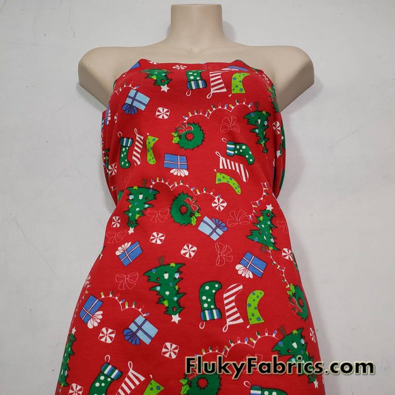 Christmas Motifs on a Red Background Cotton Rib Fabric