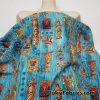 Tiki Masks on Blue Print 44″ Wide Cotton Woven Fabric