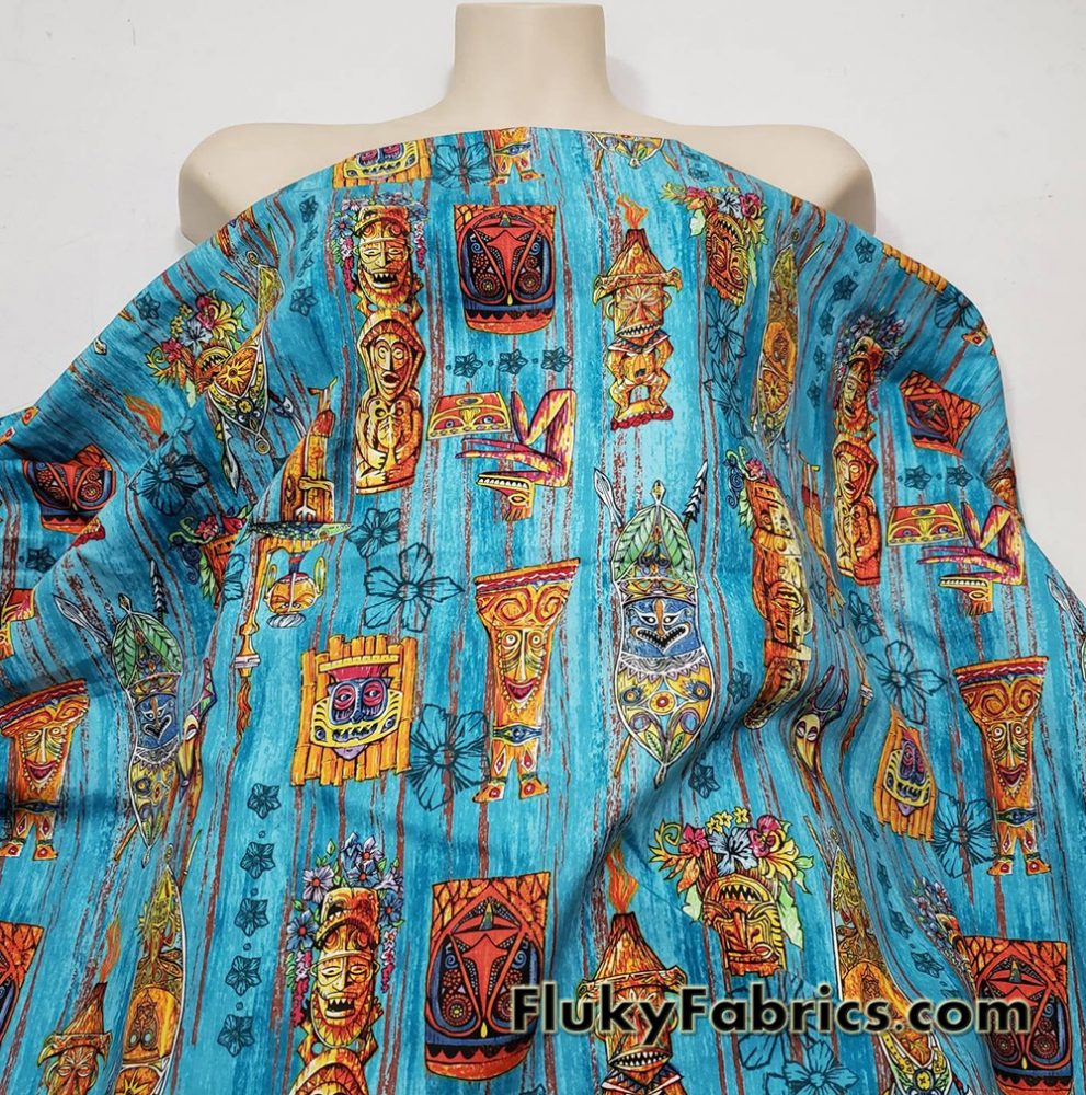 Tiki Masks on Blue Print 44″ Wide Cotton Woven Fabric