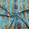 Tiki Masks on Blue Print 44″ Wide Cotton Woven Fabric