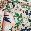 Flower and Leaves Mix Over a Peach Nylon Spandex Bathing Suit Fabric