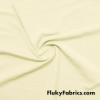 Coconut Cream Solid Nylon Spandex Swimwear Fabric at FlukyFabrics.com