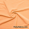 Pastel Apricot Peach Solid Nylon Spandex Swimwear Fabric at FlukyFabrics.com