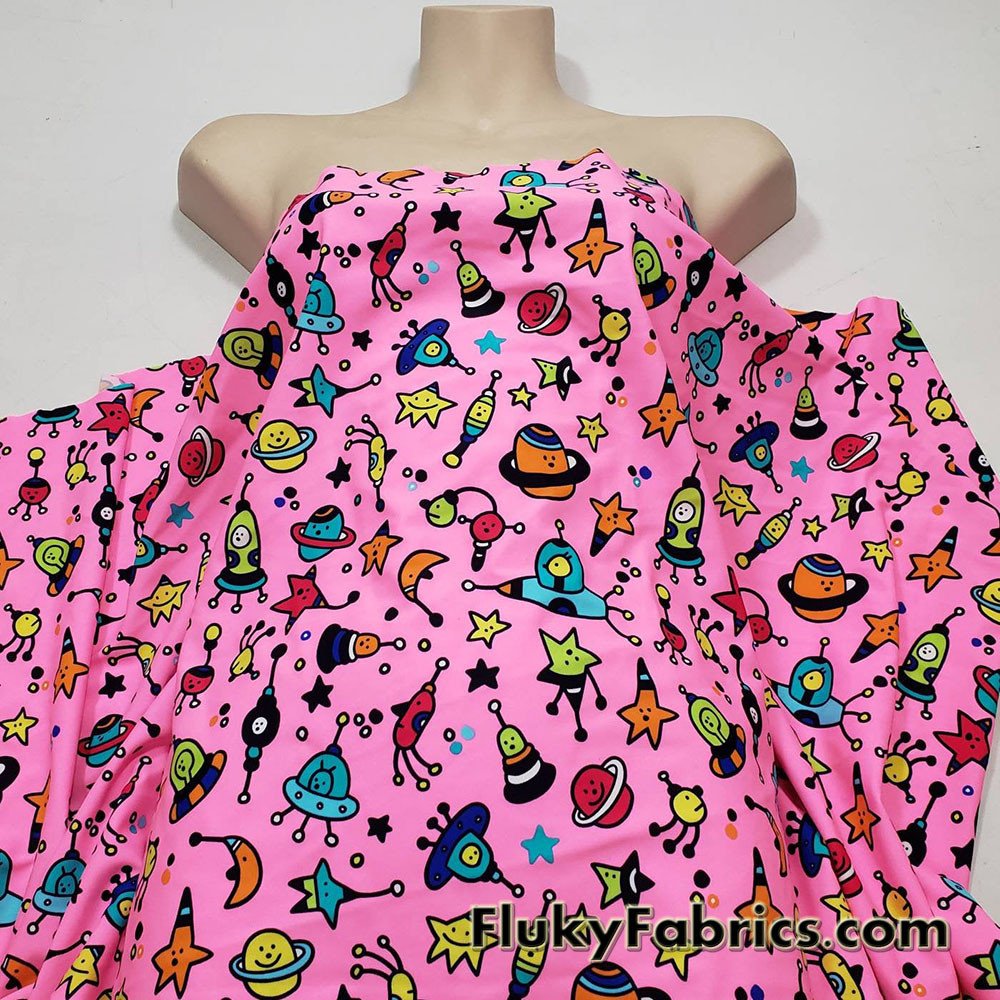 Colorful Space Doodles Over a Bright Pink Nylon Spandex Swimwear Fabric
