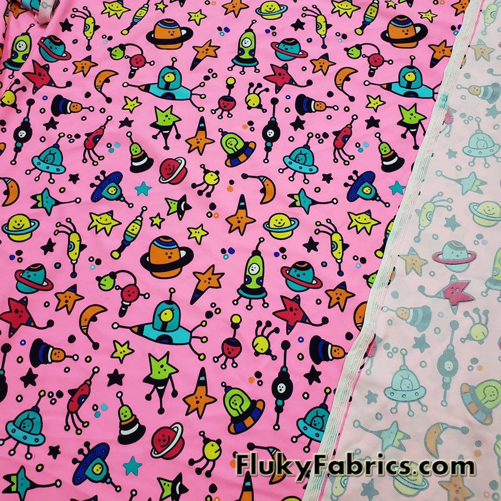 Colorful Space Doodles Over a Bright Pink Nylon Spandex Swimwear Fabric