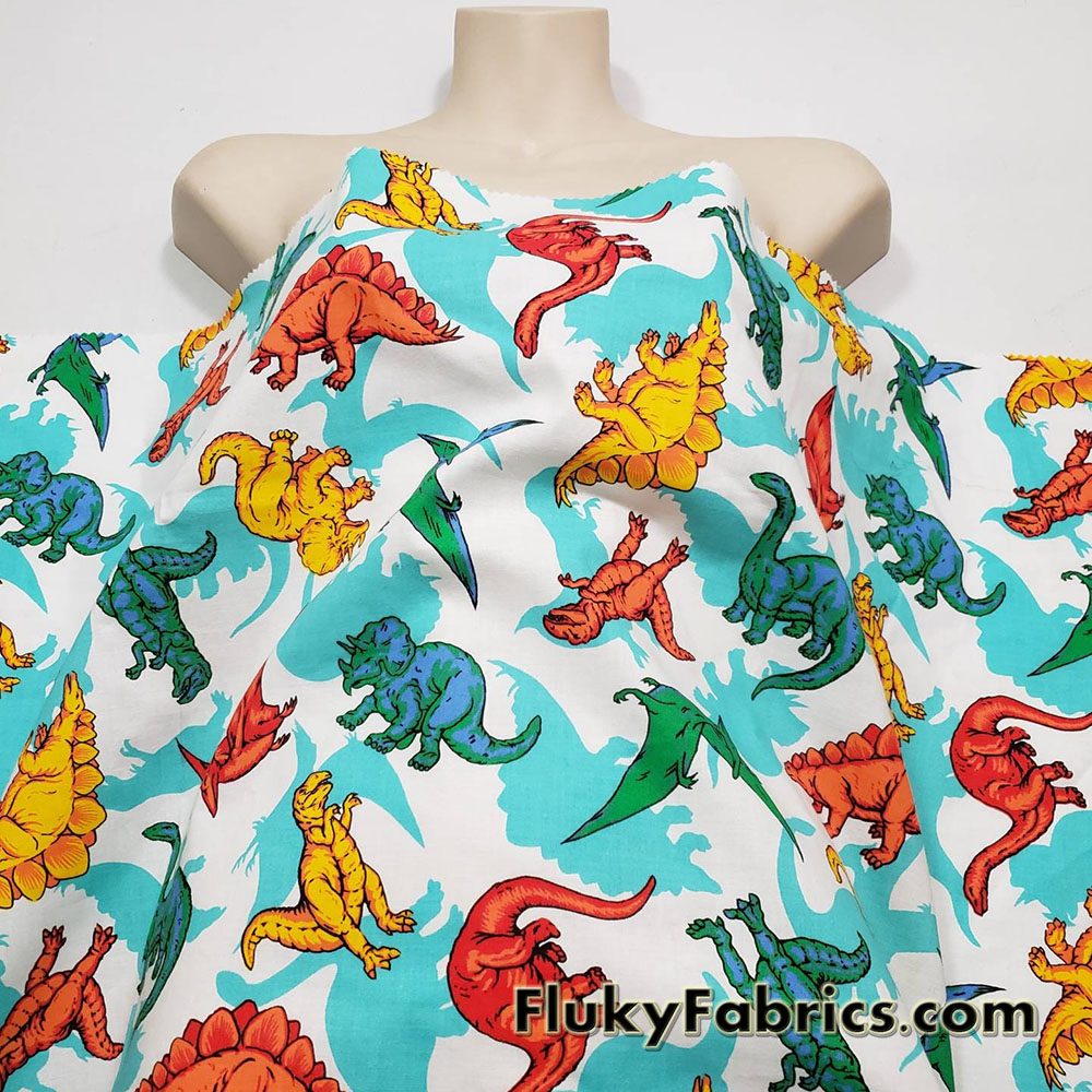 Dinosaur Delight 100% Cotton Woven Fabric – Colorful Dinosaurs on White
