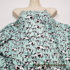 Startled Cows on Minty Green Polyester Kiana Fabric
