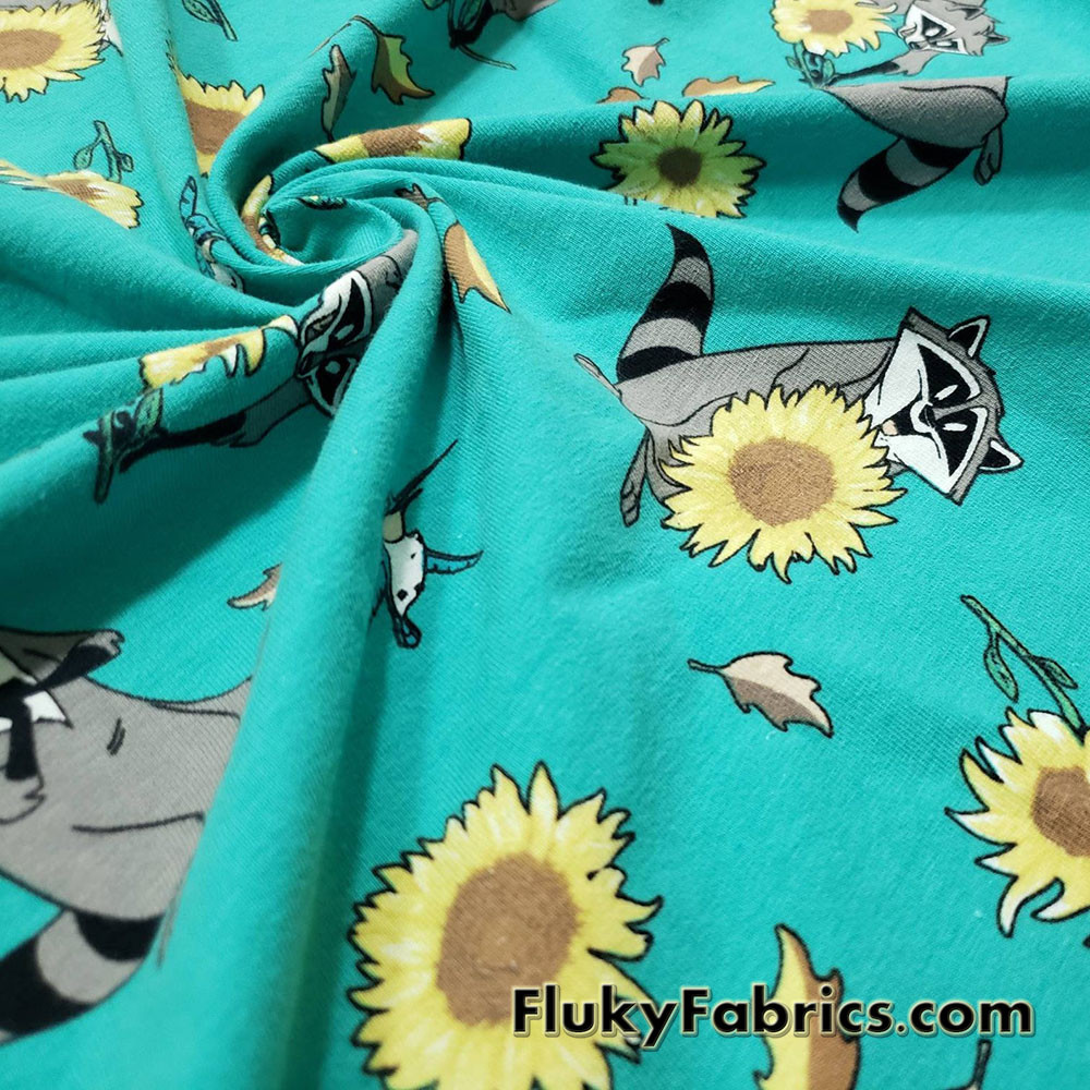 Raccoons, Hummingbirds and Sunflowers on Aqua Cotton Spandex Fabric