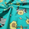 Raccoons, Hummingbirds and Sunflowers on Aqua Cotton Spandex Fabric