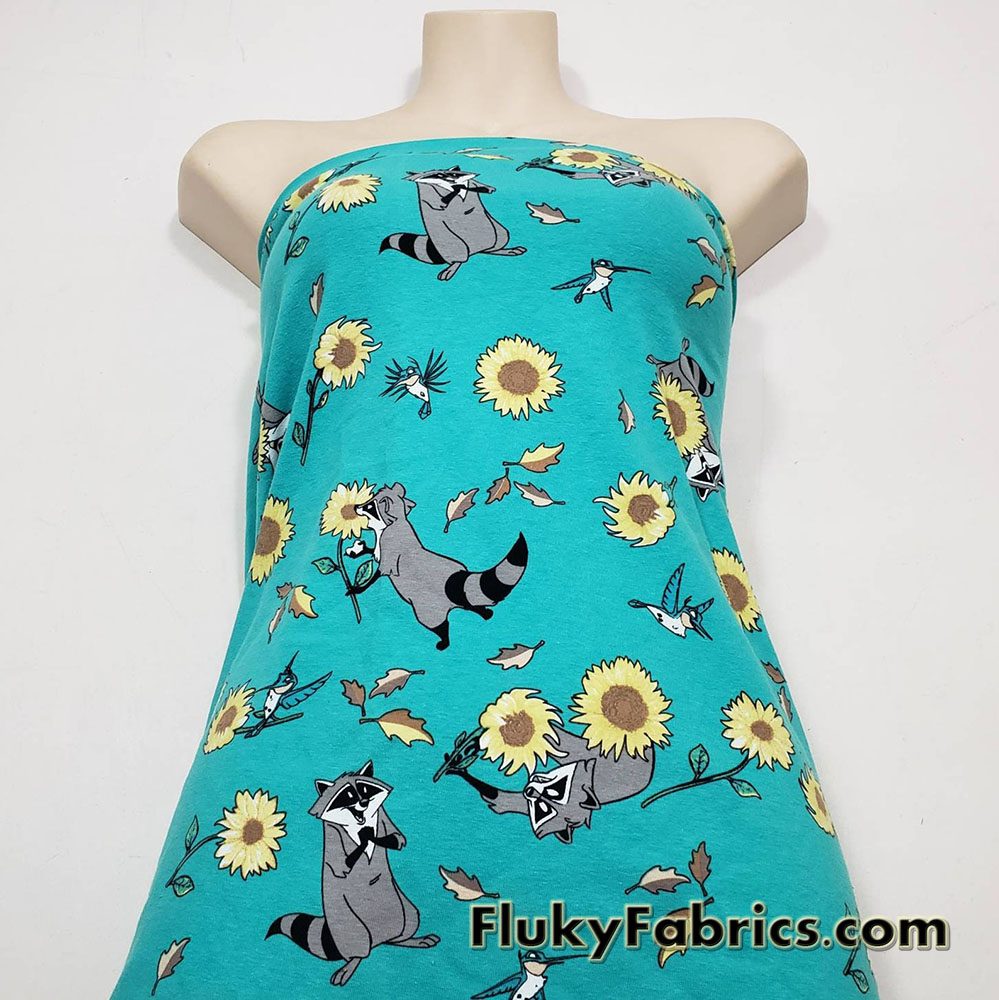 Raccoons, Hummingbirds and Sunflowers on Aqua Cotton Spandex Fabric