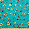 Raccoons, Hummingbirds and Sunflowers on Aqua Cotton Spandex Fabric at FlukyFabrics.com
