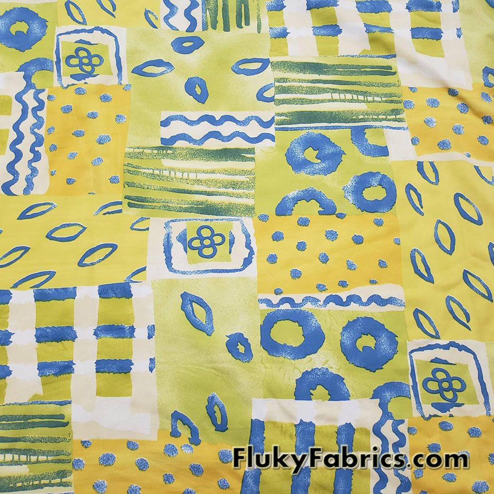 Shades of Yellow, Green and Blue Ethnic Abstract Print Nylon Spandex 4 Way Stretch Fabric