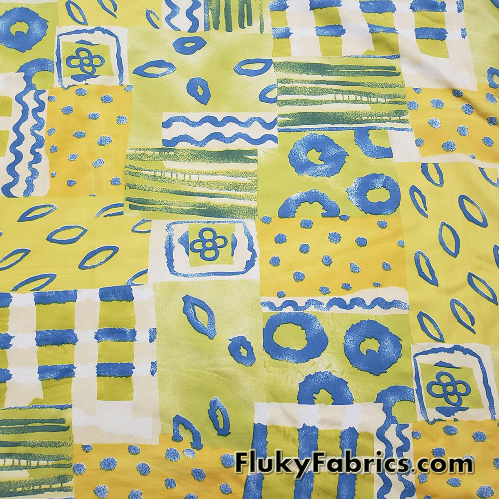 Shades of Yellow, Green and Blue Ethnic Abstract Print Nylon Spandex 4 Way Stretch Fabric