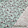 Startled Cows on Minty Green Polyester Kiana Fabric