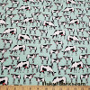 Startled Cows on Minty Green Polyester Kiana Fabric at FlukyFabrics.com