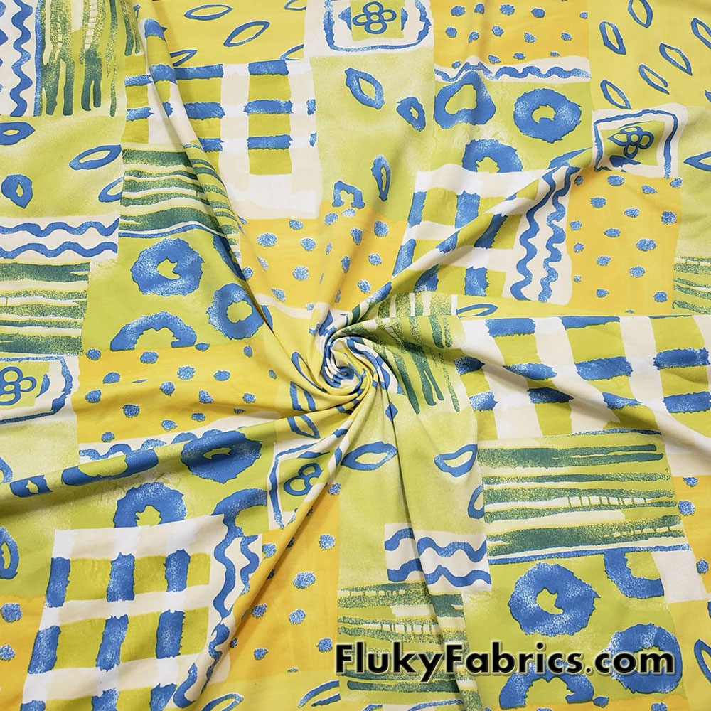 Shades of Yellow, Green and Blue Ethnic Abstract Print Nylon Spandex 4 Way Stretch Fabric