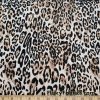 Lightweight Brown and Black Animal Print Poly Spandex Fabric at FlukyFabrics.com
