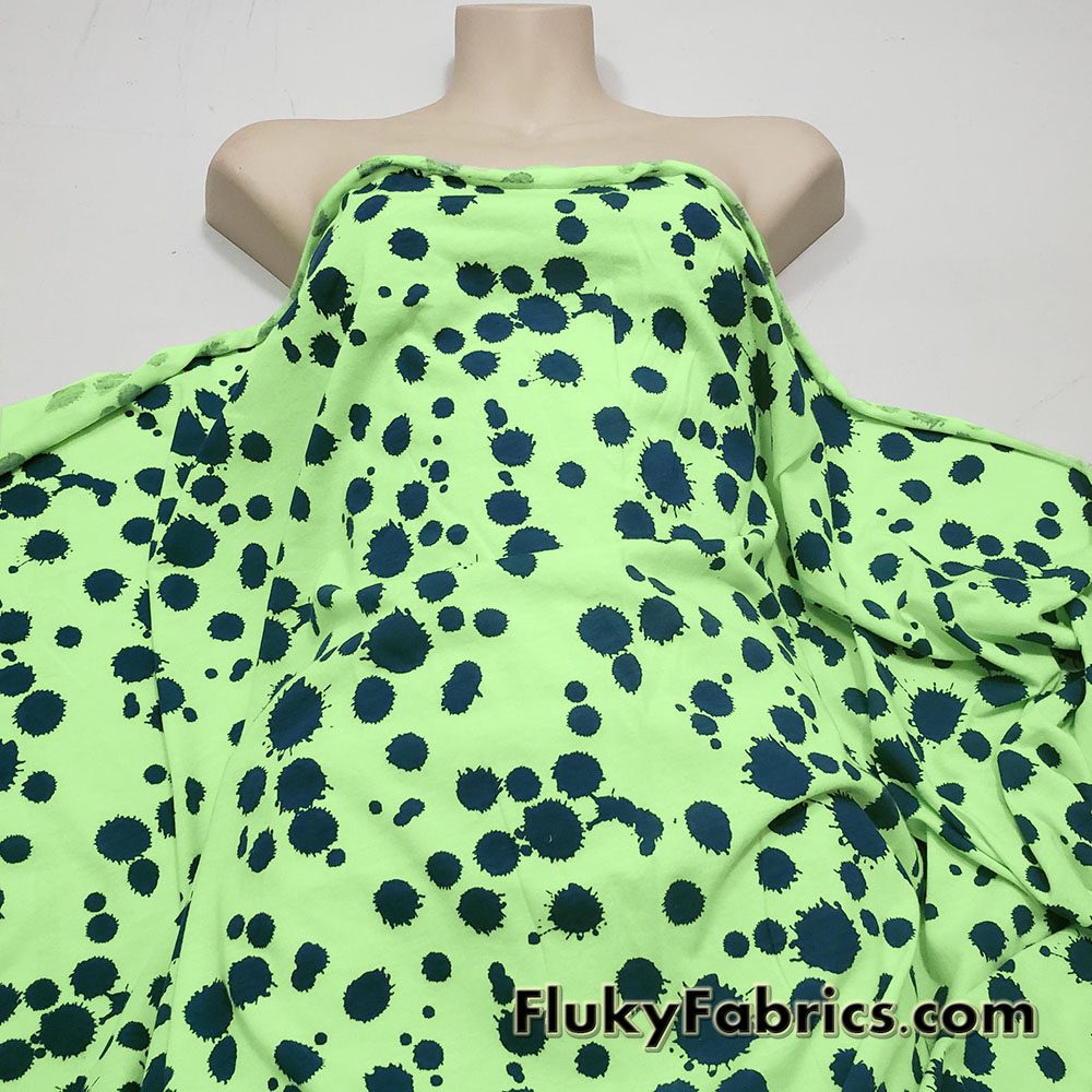 Navy Paint Splotches Over a Bright Lime Poly Cotton Jersey Fabric By The Yard
