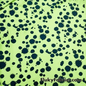 Navy Paint Splotches Over a Bright Lime Poly Cotton Jersey Fabric By The Yard at FlukyFabrics.com
