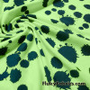Navy Paint Splotches Over a Bright Lime Poly Cotton Jersey Fabric By The Yard
