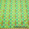 Colorful Squares and Dots on Lime Green Print Poly Spandex Fabric at FlukyFabrics.com