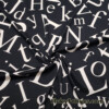 Big Scattered Ivory Letters Print on Black Ponte de Roma Knit Fabric
