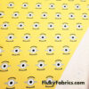 One Eyed Cartoon on Yellow Polyester Woven Knit Boardshort Fabric