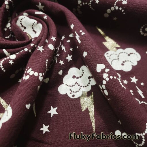 Clouds, Lightning, Hearts and Stars Print on Dark Burgundy Color Fleece Fabric