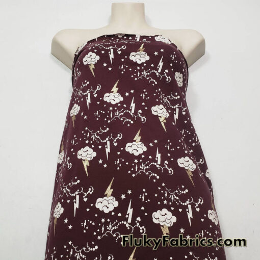 Clouds, Lightning, Hearts and Stars Print on Dark Burgundy Color Fleece Fabric