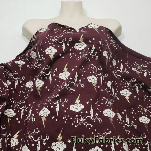 Clouds, Lightning, Hearts and Stars Print on Dark Burgundy Color Fleece Fabric