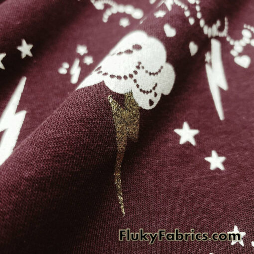 Clouds, Lightning, Hearts and Stars Print on Dark Burgundy Color Fleece Fabric
