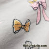 Assorted Bows Print on Light Gray Lightweight Cotton Spandex Jersey Fabric