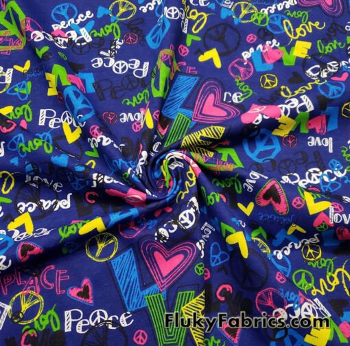 Colorful Love and Peace Signs Print on Royal Blue French Terry 100% Cotton Fabric