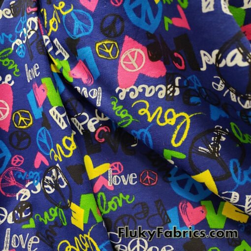 Colorful Love and Peace Signs Print on Royal Blue French Terry 100% Cotton Fabric